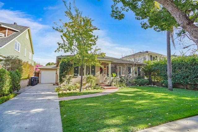 view of front of property with a front yard and a garage