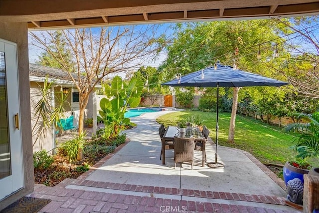 view of patio / terrace with a fenced in pool