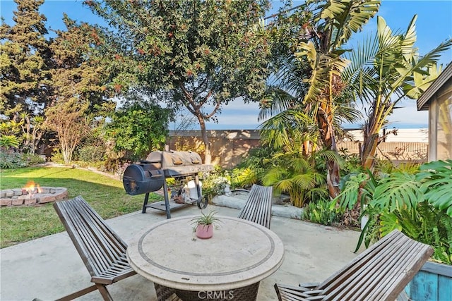 view of patio / terrace featuring area for grilling and an outdoor fire pit