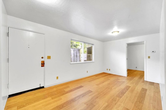 foyer entrance with light hardwood / wood-style flooring