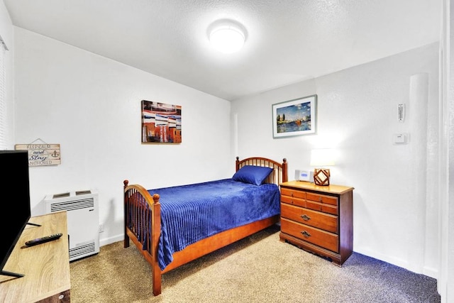 carpeted bedroom with heating unit