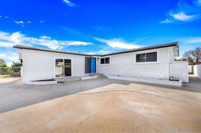 rear view of house featuring a patio