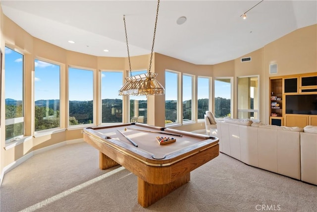 rec room featuring lofted ceiling, baseboards, light carpet, and visible vents