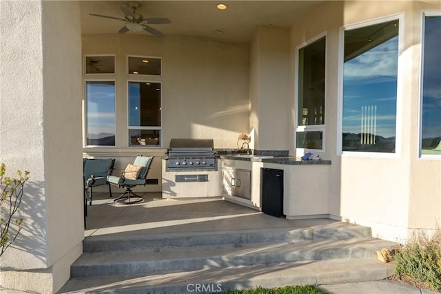 view of patio / terrace with grilling area, area for grilling, and a ceiling fan