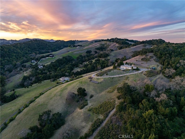 aerial view at dusk with a mountain view