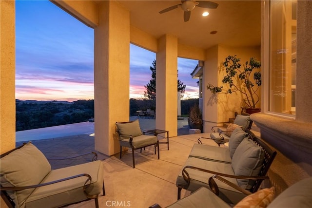 view of patio featuring ceiling fan