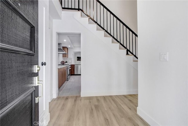 entryway with light hardwood / wood-style floors