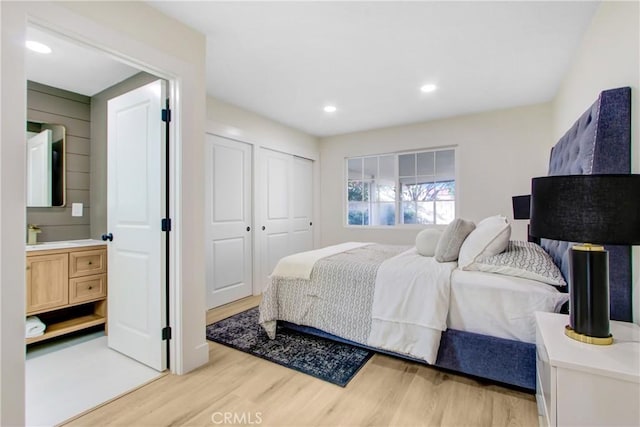 bedroom featuring light hardwood / wood-style floors and a closet