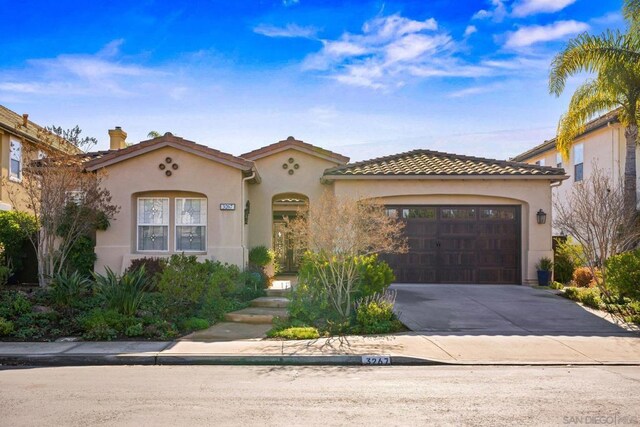 mediterranean / spanish-style house featuring a garage