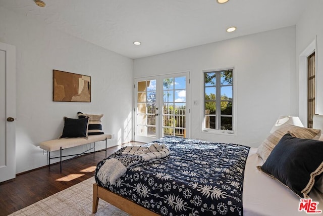 bedroom with dark hardwood / wood-style floors and french doors