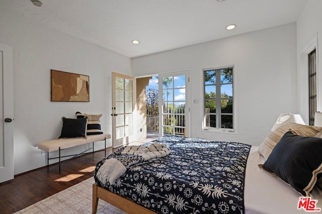 bedroom with hardwood / wood-style floors