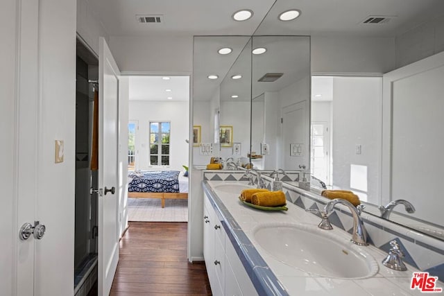 bathroom with wood-type flooring and vanity