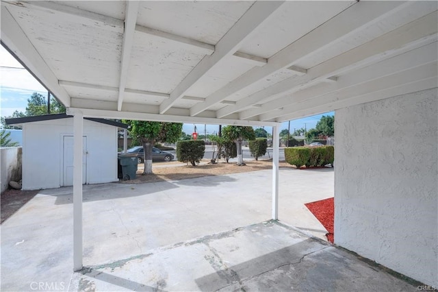 view of patio with a storage unit