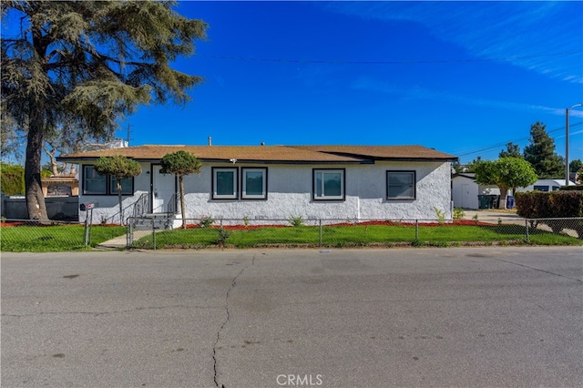 ranch-style house with a front lawn