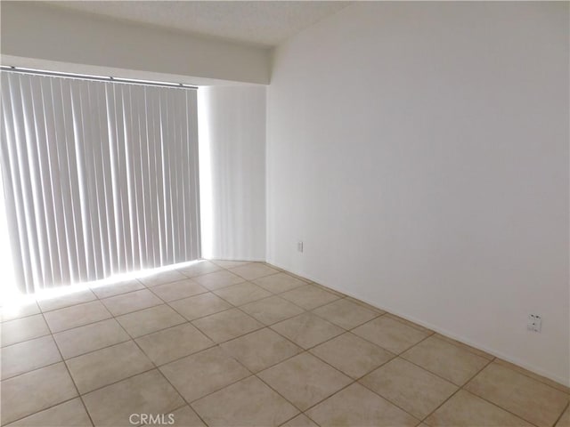 empty room featuring light tile patterned floors