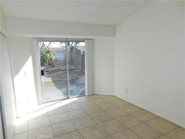 spare room with light tile patterned floors