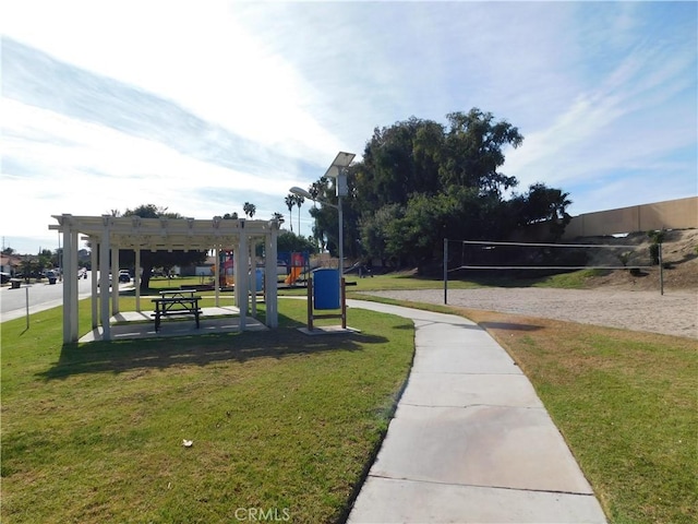 view of home's community featuring a yard, a pergola, and volleyball court