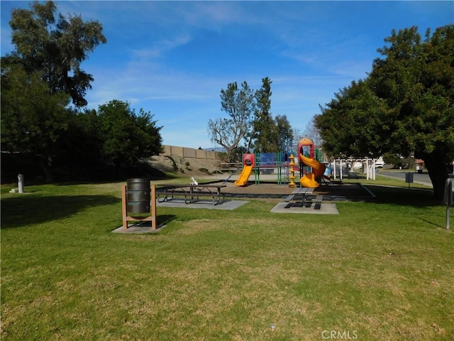 view of play area featuring a lawn