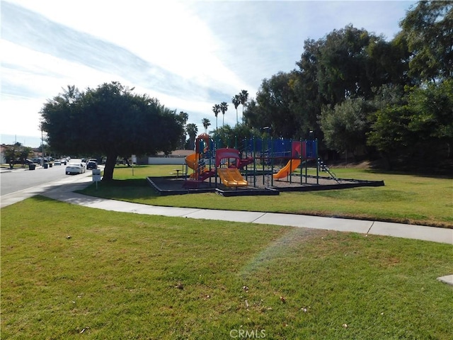 view of jungle gym featuring a lawn