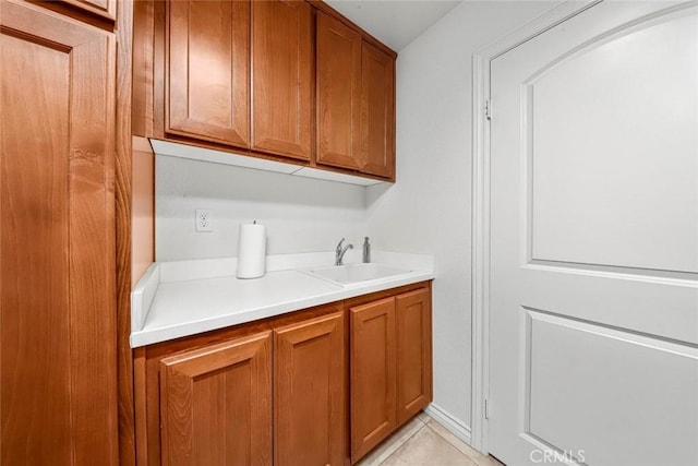 interior space featuring light tile patterned floors and sink