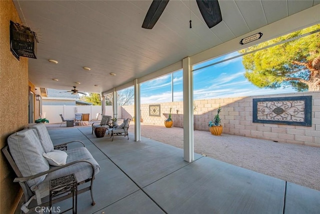 view of patio featuring ceiling fan