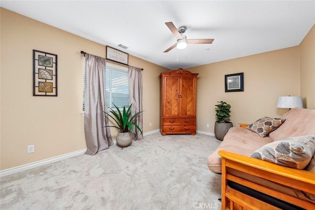 sitting room with light carpet and ceiling fan