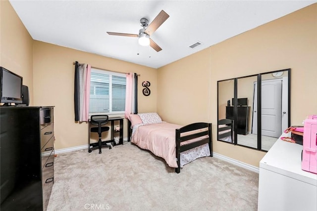 bedroom featuring ceiling fan and light colored carpet