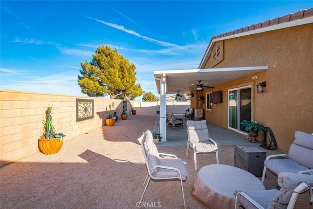 view of patio / terrace featuring ceiling fan