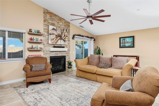 living room featuring ceiling fan, light tile patterned floors, high vaulted ceiling, and a fireplace