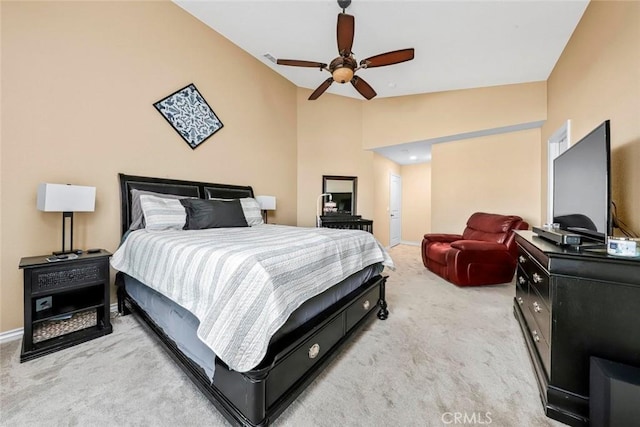 carpeted bedroom featuring ceiling fan and vaulted ceiling