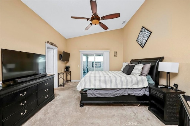 bedroom featuring lofted ceiling, light colored carpet, and ceiling fan