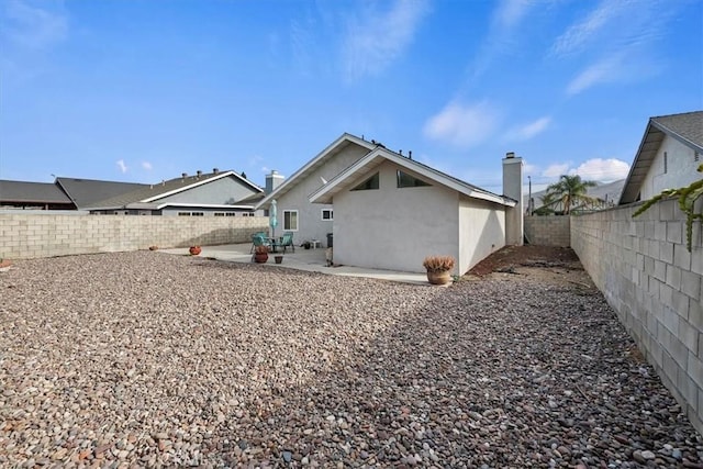 rear view of property with a patio area