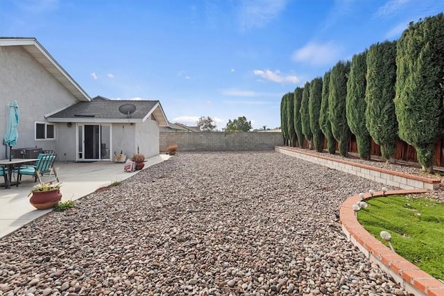 view of yard with a patio area