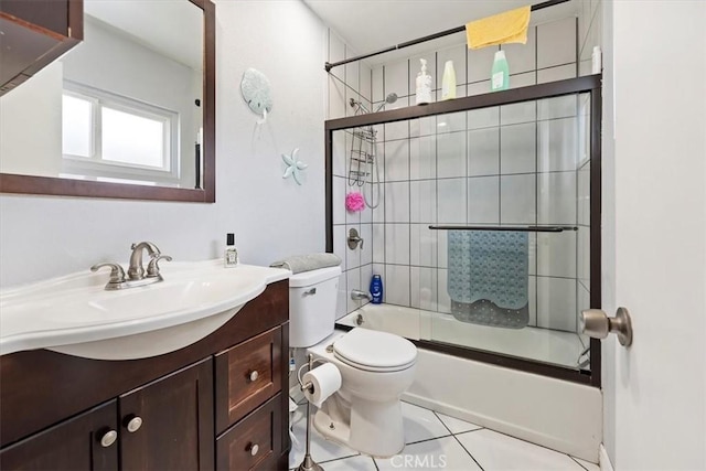 full bathroom featuring toilet, tile patterned flooring, enclosed tub / shower combo, and vanity