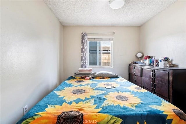 bedroom featuring a textured ceiling