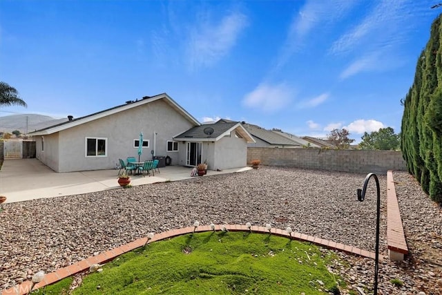 back of house featuring a patio