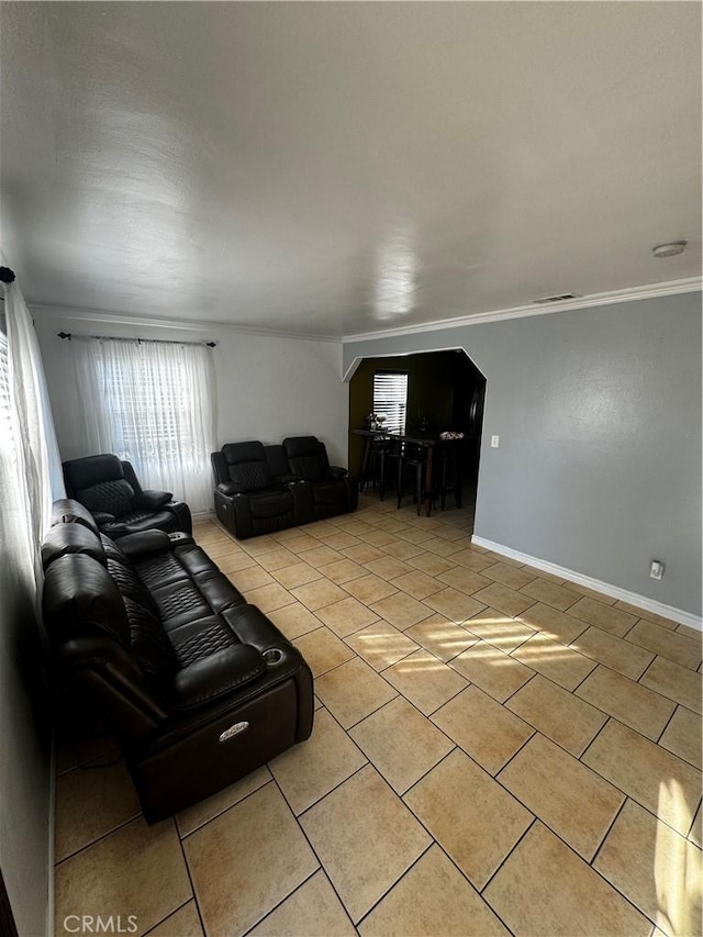 tiled living room featuring ornamental molding