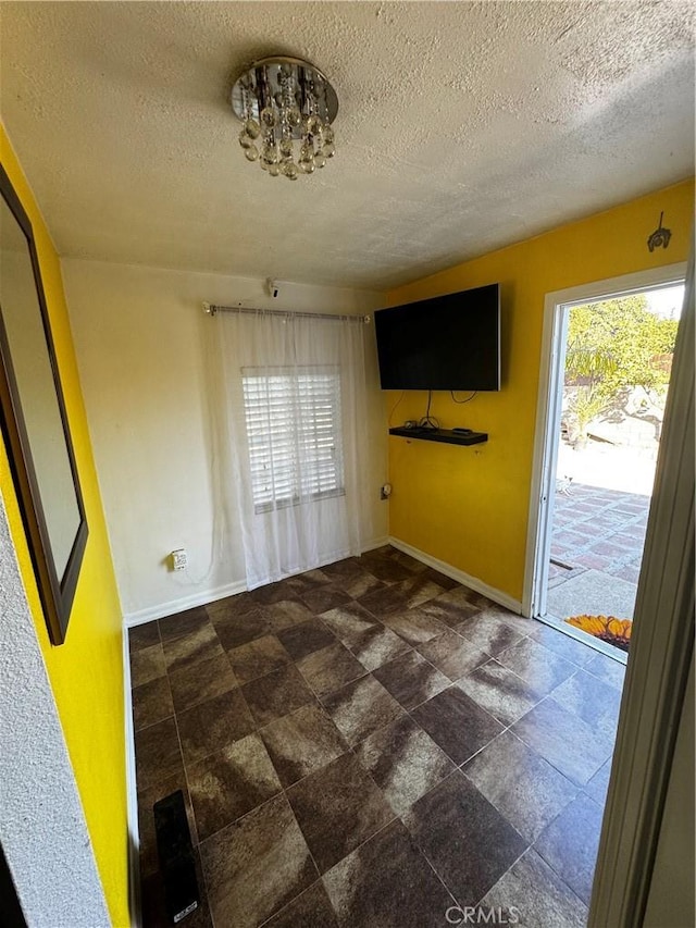 interior space featuring a textured ceiling