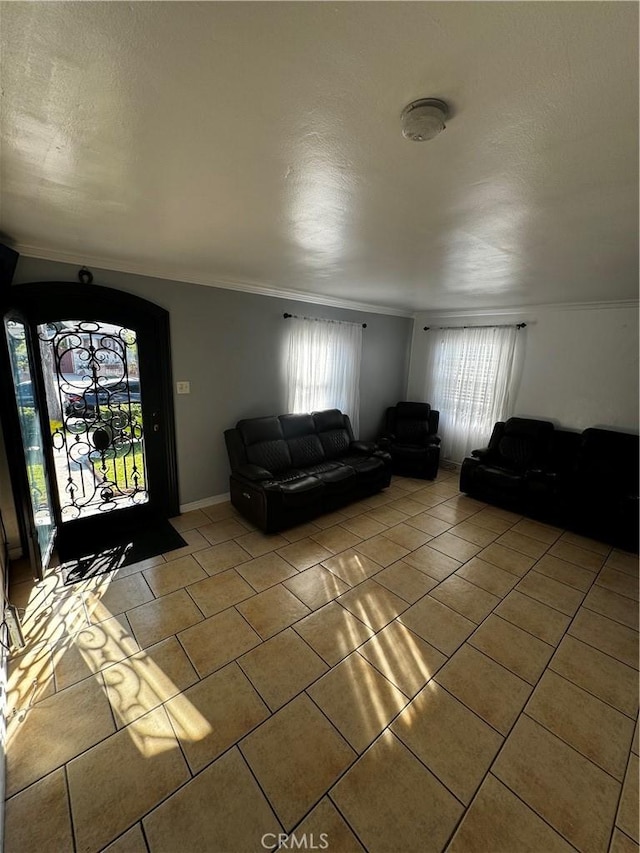 unfurnished living room with light tile patterned floors and ornamental molding