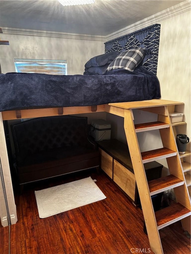 bedroom featuring dark hardwood / wood-style floors and crown molding