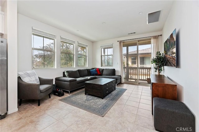 living room with light tile patterned floors