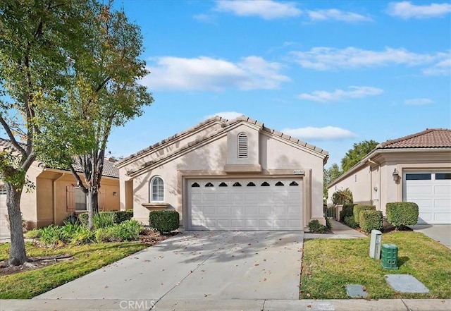 mediterranean / spanish-style home with concrete driveway, stucco siding, and a garage