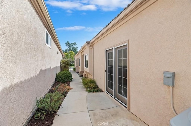 view of side of home featuring a patio