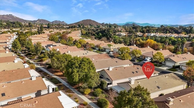 birds eye view of property with a mountain view and a residential view