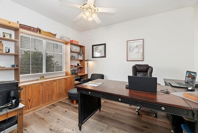 office featuring light wood finished floors and a ceiling fan