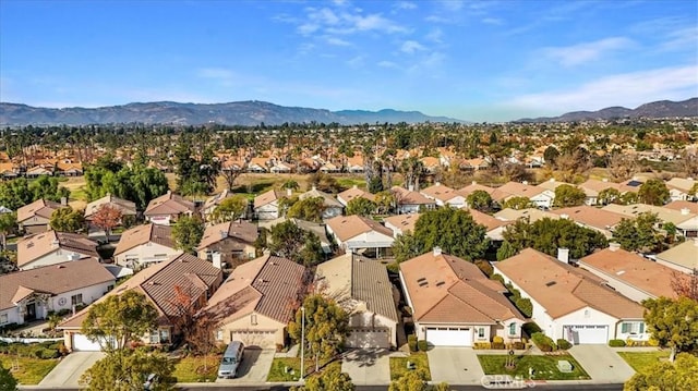 drone / aerial view featuring a mountain view and a residential view