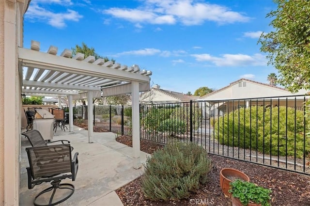 view of patio featuring fence and a pergola