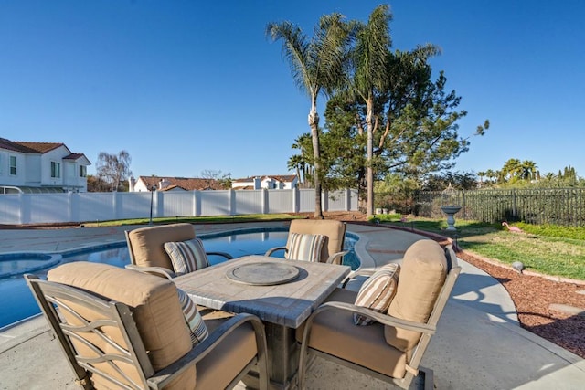 view of patio with a fenced in pool