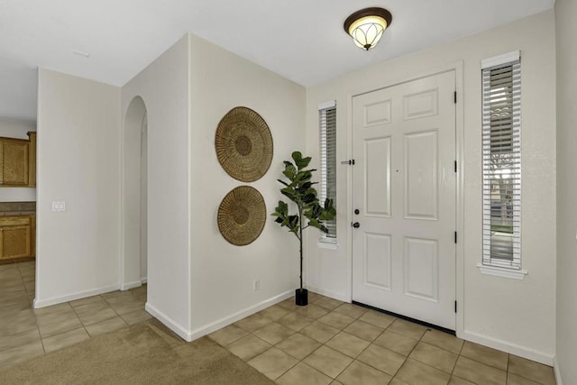 entrance foyer with light tile patterned floors