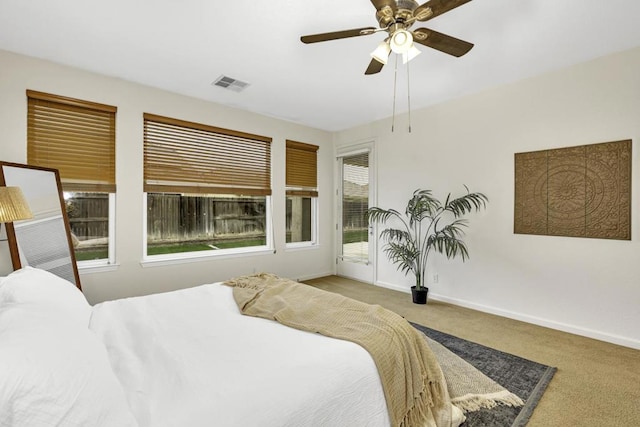 bedroom featuring ceiling fan, light carpet, and access to outside